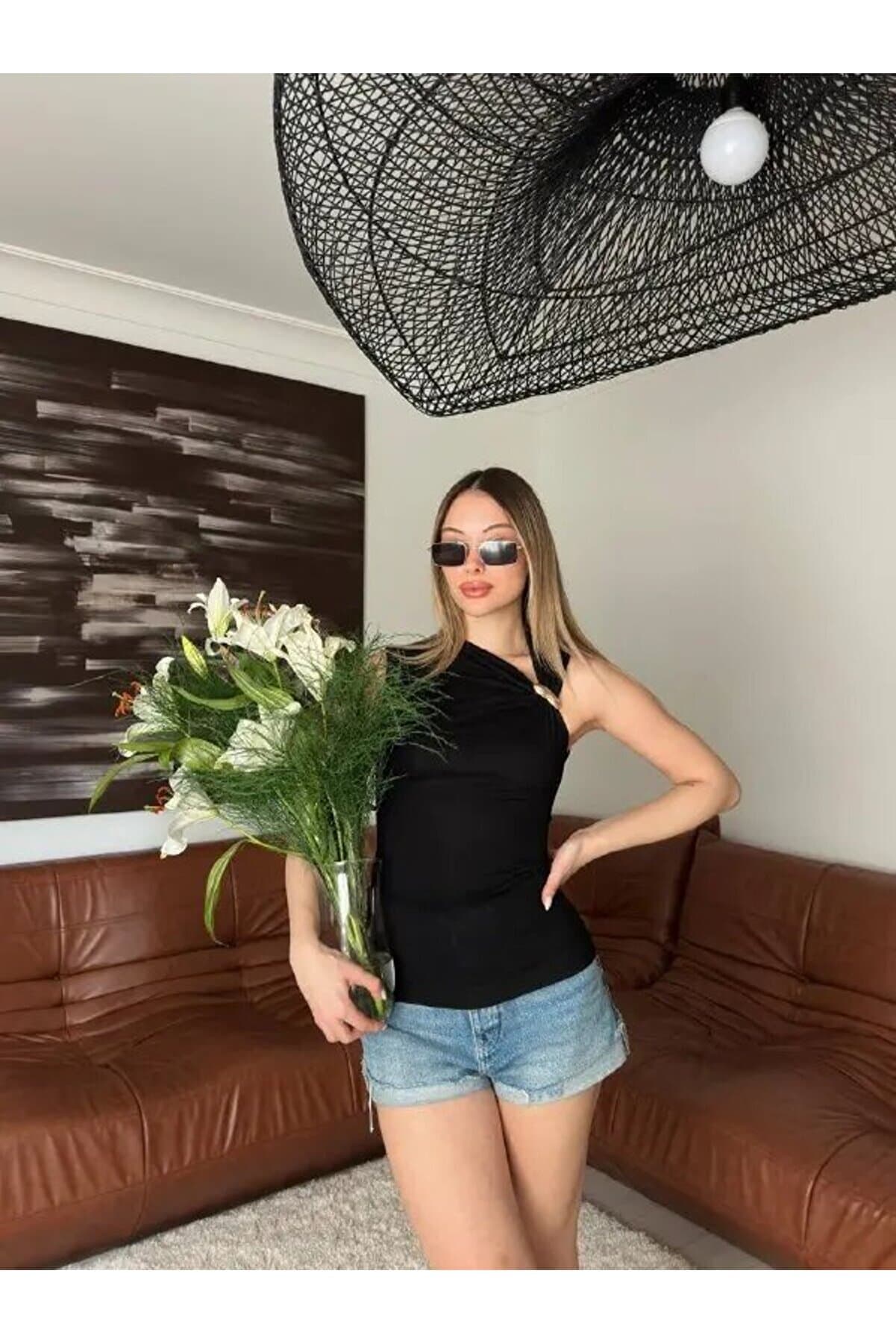 Draped Black Blouse with Gold Accessories
