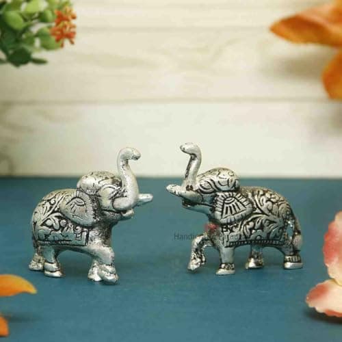 Handicrafts Paradise Carved Aluminium Metal Elephant Showpiece (7.65 cm x 2.55 cm x 6.3 cm, Set of 2)