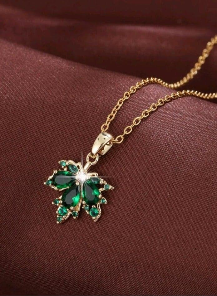 Trendy Stylish Gold Plated Stainless Steel Necklace For Women With A Green Leaf Flower
