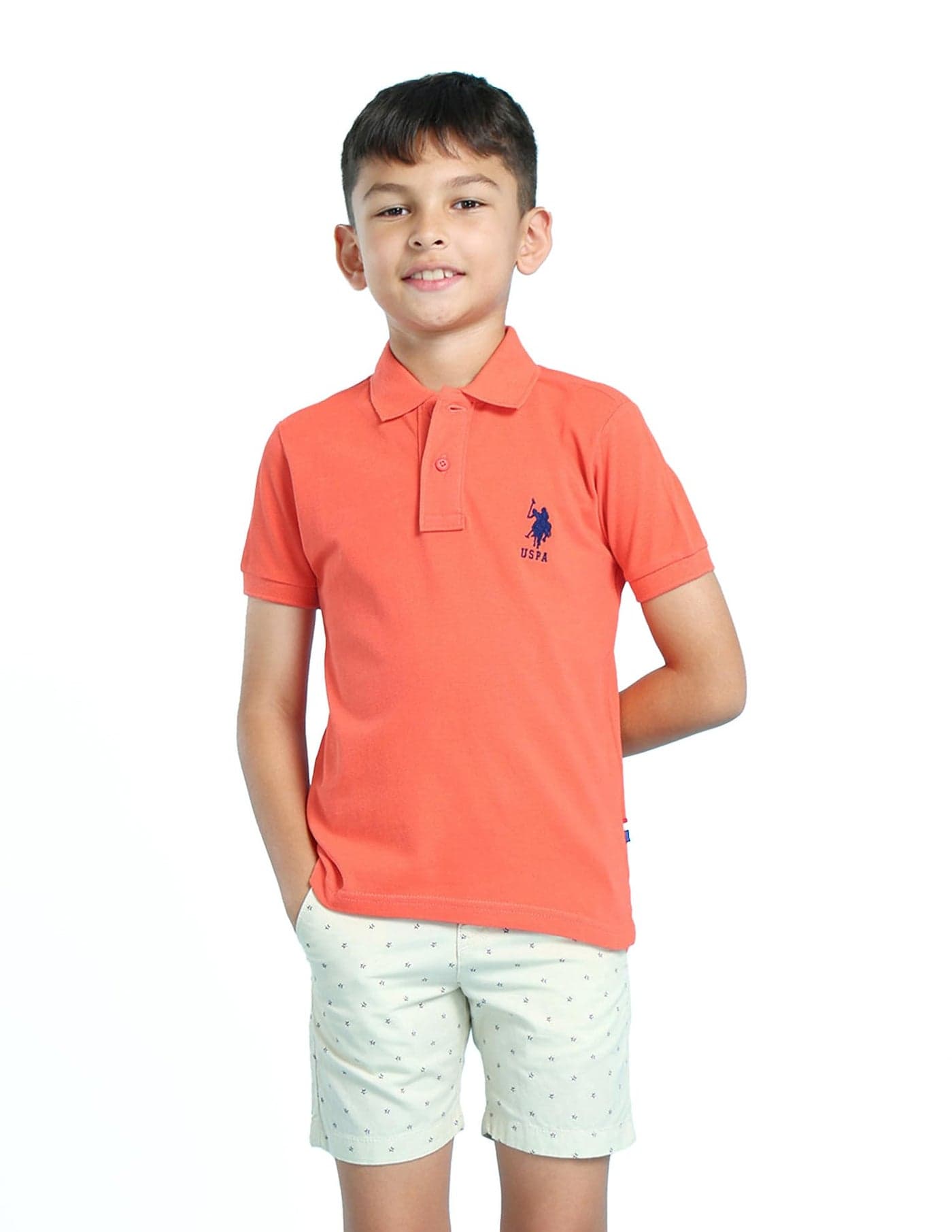 U.S. POLO ASSN. Solid Polo T-Shirt for Boys, Pique Knit - Regular Fit with Ribbed Polo Collar, Short Sleeves Kids T Shirt -M, Coral