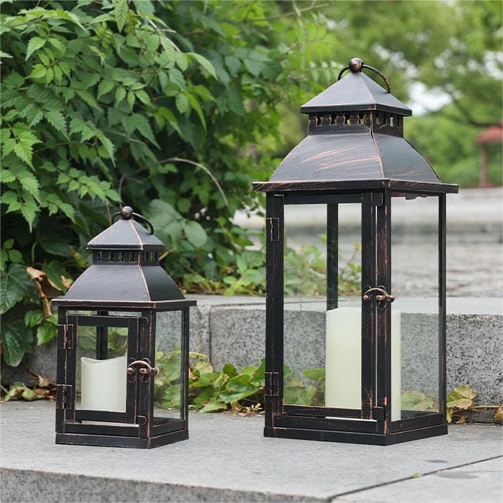 NEEDOMO Lanterns Decorative OutdoorIndoor Set of 2 Large Bronze Metal Lantern Decor with Glass Candle Holder for Porch Patio Garden Balcony Wedding Table Centerpiece Decorations