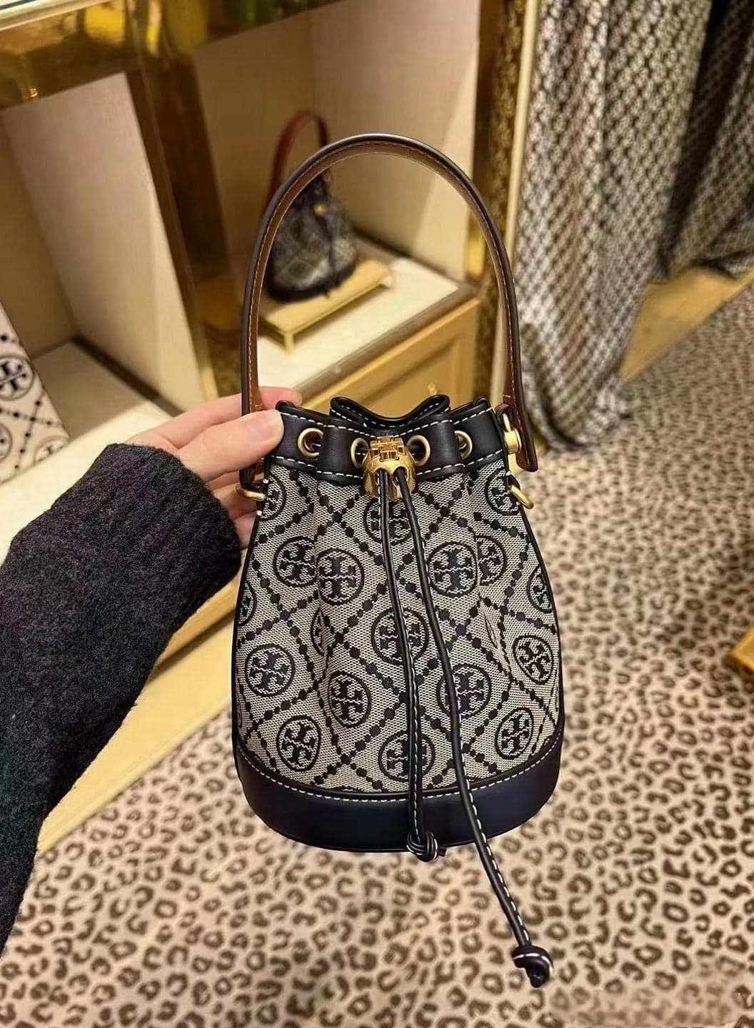 MINI T MONOGRAM BUCKET BAG