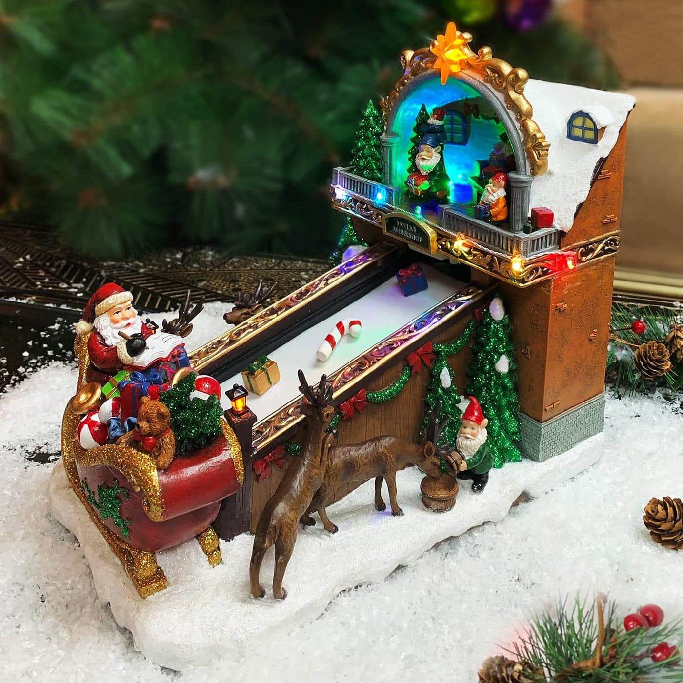 MOMENTS IN TIME Christmas Village Building Santas Toy Shop Conveyer Belt Loading his Sleigh with Christmas Music LED Lights and Animation Power Adapter Included 104 H x 72 W x 106 D