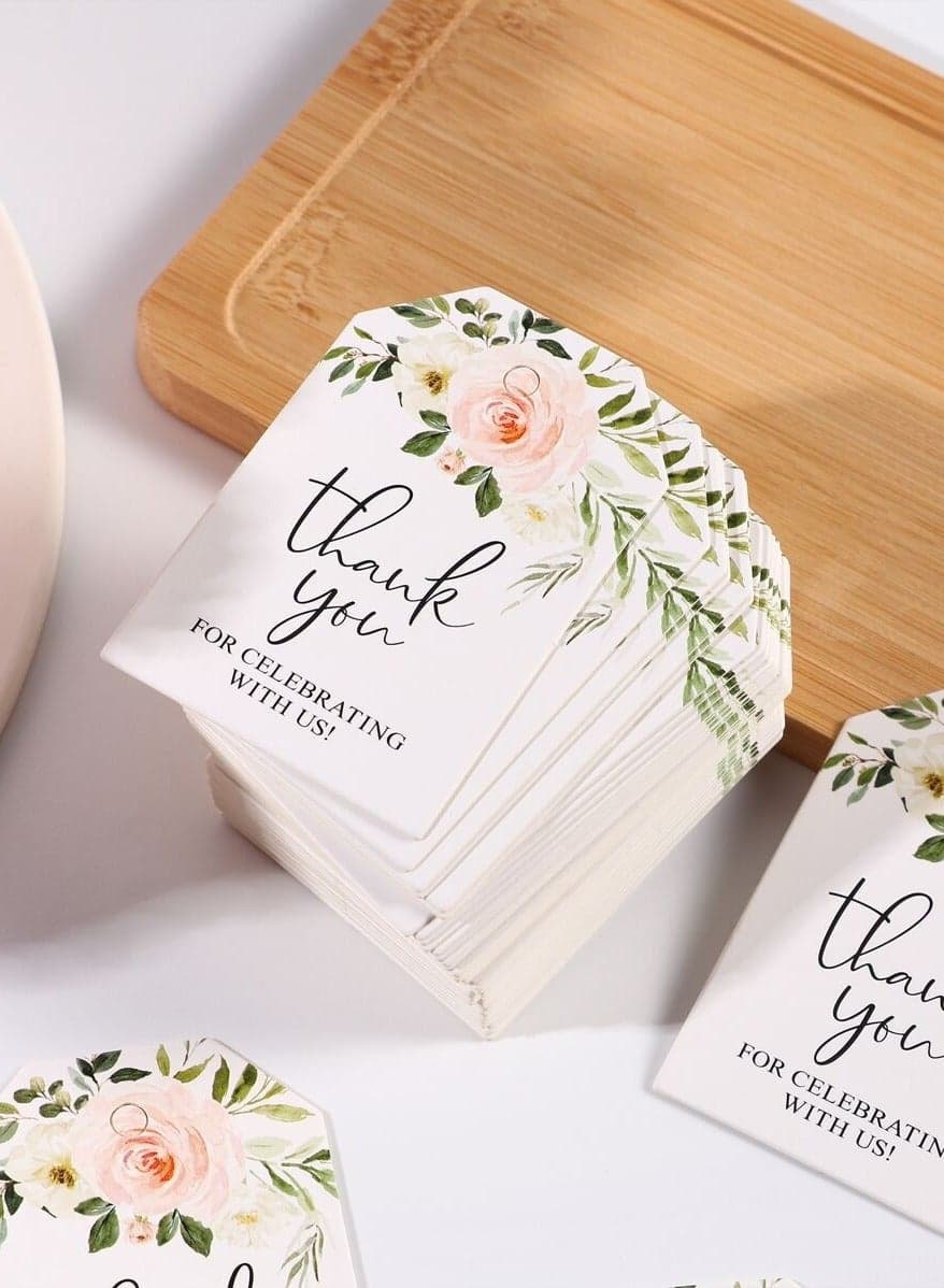 Paper thank-you cards with the phrase Thank you for celebrating with us, decorated with a lovely floral design. Set of 25 cards to attach to gifts and favors for weddings, engagements, bridal shower