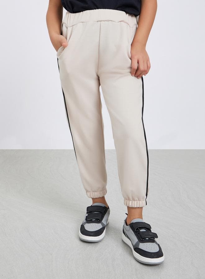 Girls Beige Solid Joggers With Side Binding