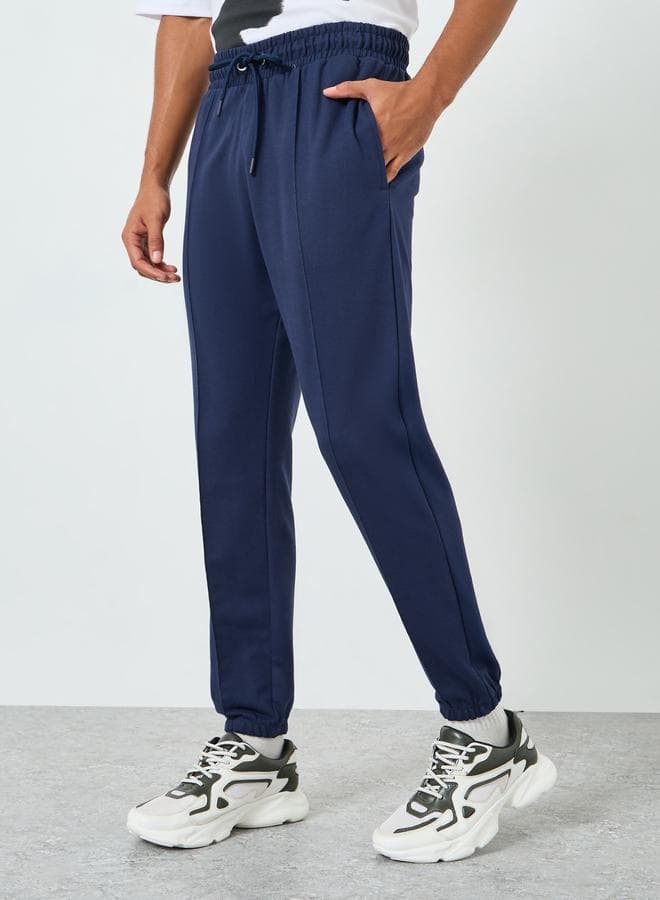 Men Navy Blue Solid Joggers With Pintuck Detail