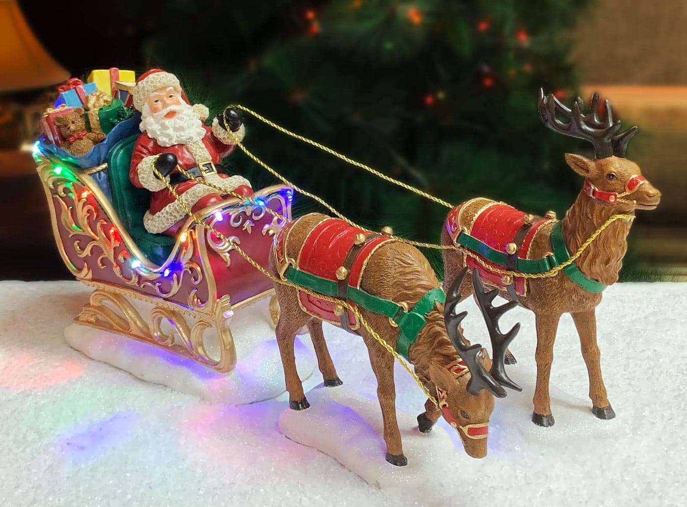 MOMENTS IN TIME Santa Riding Sleigh with Reindeer Christmas Decoration LED Lighted Tabletop Display HandPainted Polyresin Battery Operated not Included Ready Christmas Decoration