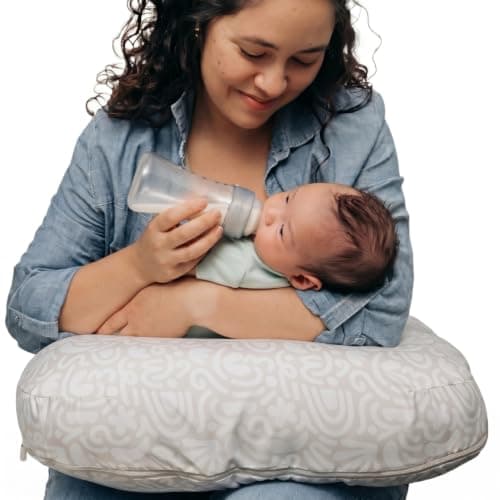 Boppy Nursing Pillow Firm Ergonomic UShaped Bottle and Breastfeeding Pillow with High Lift for Comfort and Support Spacious Surface Cream Retro Squiggles